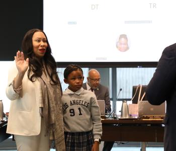 Dr. Unique N. Morris-Hughes being sworn in at the Board of Directors Meeting