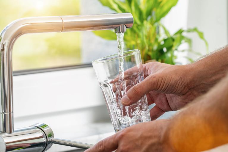 Photo of water flowing from a tap