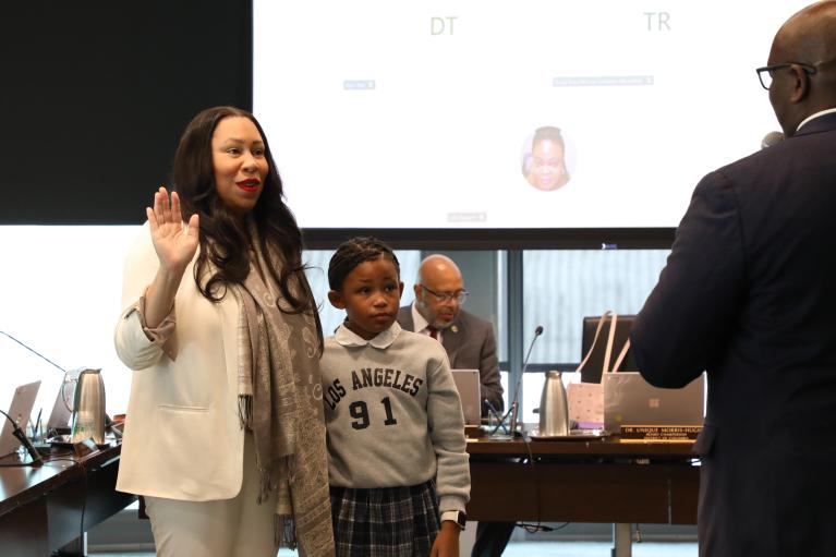 Dr. Unique N. Morris-Hughes being sworn in at the Board of Directors Meeting