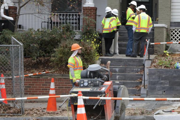 Lead Fee DC workers at home getting lead service line replacement