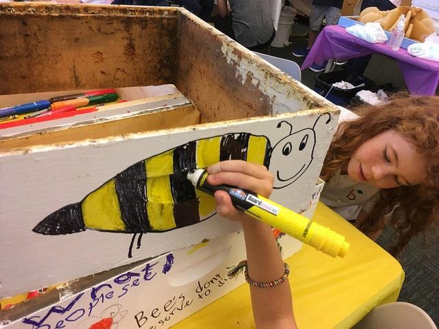 Photo of student drawing a bee
