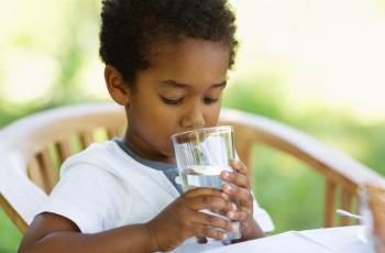 Photo of child drinking tap water from a glass